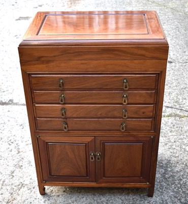 Lot 371 - A mahogany canteen with four drawers over two...