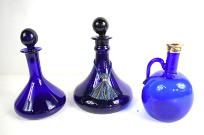 Lot 164 - Three Bristol blue glass decanters to include...