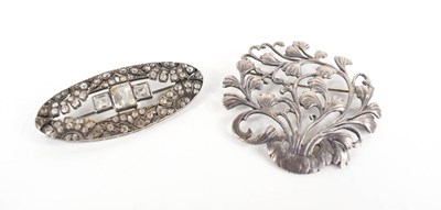 Lot 104 - A silver brooch in the form od a foliate spray,...