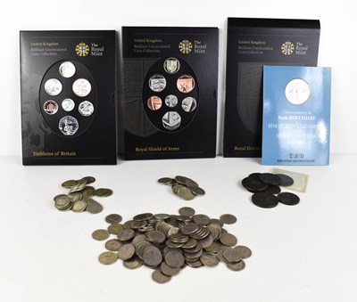 Lot 266 - A group of coins to include presentation packs;...