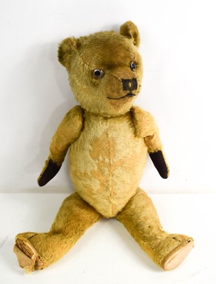 Lot 8 - A vintage teddy bear, straw filled,...