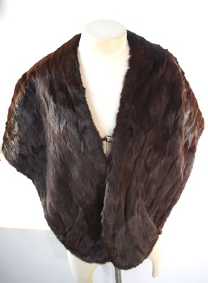 Lot 362 - A brown fur stole with pockets at either end.