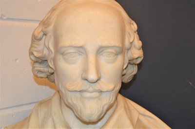 Lot 124 - A carved marble bust of William Shakespeare...