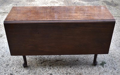 Lot 387 - A George II mahogany dining table with two...