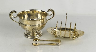 Lot 277 - A silver bowl with twin handles in the form of...