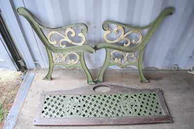 Lot 416 - A pair of vintage cast iron bench ends...