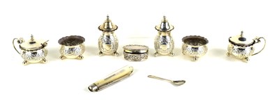 Lot 366 - A group of silver to include a pair of pepper...