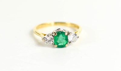 Lot 110 - An 18ct gold, diamond and emerald ring, the...