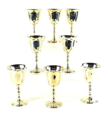 Lot 393 - A set of eight silver wine goblets with...