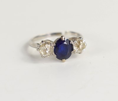 Lot 117 - A white gold, diamond and sapphire three stone...