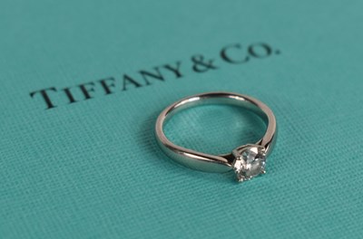 Lot 14 - A Tiffany & Co platinum diamond solitaire ring,...