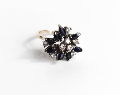 Lot 17 - An 18ct gold, sapphire and diamond cluster...