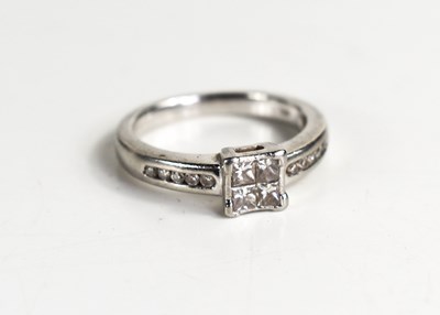 Lot 122 - A platinum and diamond ring, set with four...