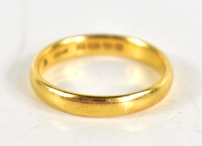 Lot 131 - A 22ct gold wedding band, size M, 3.8g.