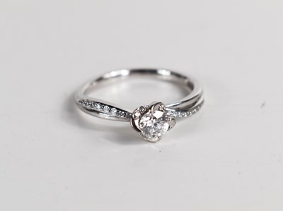 Lot 133 - A 9ct gold and diamond solitaire ring, the...