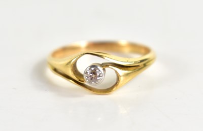 Lot 134 - An 18ct gold and diamond solitaire ring in the...