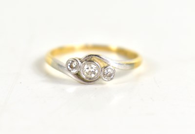 Lot 135 - An 18ct gold and platinum three stone diamond...