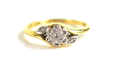 Lot 136 - An 18ct gold and diamond flower form ring, 2.8g.