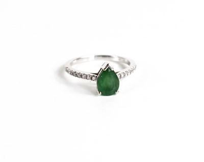 Lot 138 - A 14ct white gold, emerald and diamond ring,...