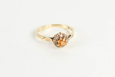 Lot 145 - A 9ct gold, citrine and diamond ring, size L½,...