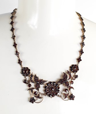 Lot 23 - An antique gilt metal and garnet set necklace,...