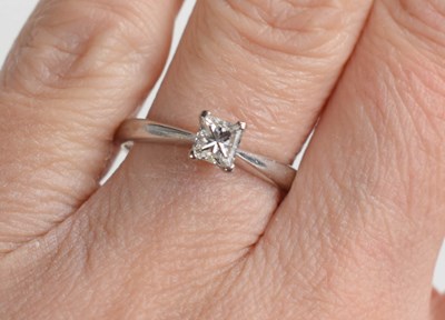 Lot 159 - An 18ct gold solitaire ring, with princess cut...