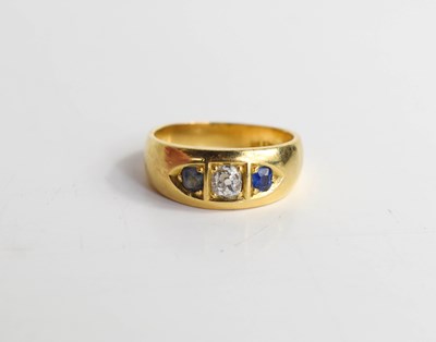 Lot 160 - An 18ct gold diamond and sapphire ring, the...