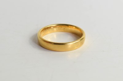 Lot 161 - A gold wedding band (unmarked, bearing...