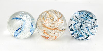 Lot 177 - Two Langham glass paperweights, together with...