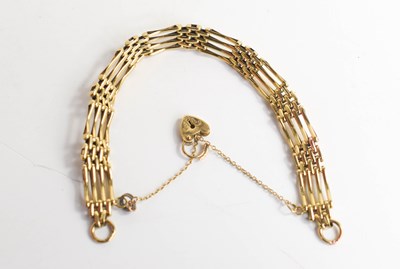 Lot 177 - A 9ct gold gate link bracelet, with a heart...