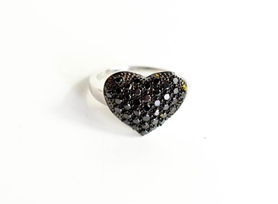 Lot 3 - A 9ct white gold and black diamond heart form...