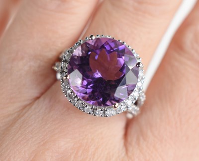 Lot 27 - A 9ct white gold, amethyst and diamond dress...