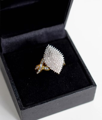 Lot 217 - A 9ct gold and diamond cluster ring in...