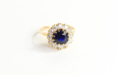 Lot 218 - A gold, sapphire and diamond ring, the...