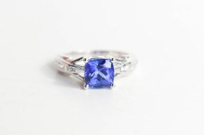 Lot 28 - An 18ct white gold and tanzanite asscher cut...