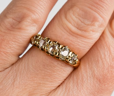 Lot 280a - An 18ct gold and diamond ring, the five...