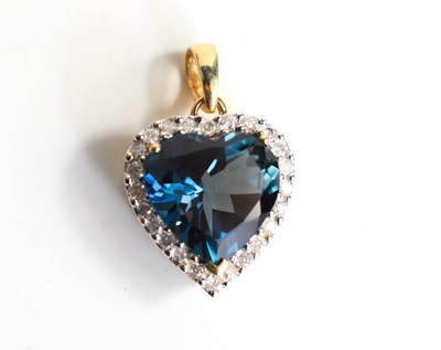 Lot 1 - A 9ct gold and blue topaz heart form pendant,...