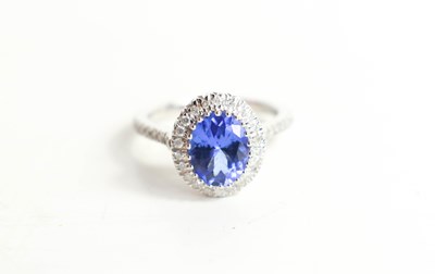 Lot 125 - An 18ct white gold, tanzanite and diamond ring,...