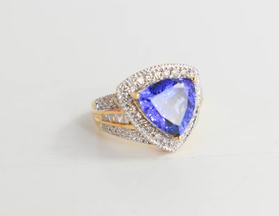 Lot 128 - An 18ct yellow gold, diamond and tanzanite...