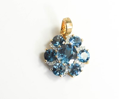 Lot 222 - A 9ct yellow gold, diamond and blue topaz...