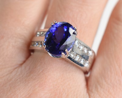 Lot 223 - A 14k white gold, tanzanite and diamond ring,...