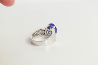 Lot 223 - A 14k white gold, tanzanite and diamond ring,...