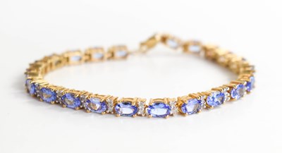 Lot 231 - A 9ct yellow gold, amethyst and diamond tennis...