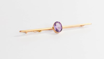 Lot 31 - A 9ct gold and oval amethyst set bar brooch, 3....