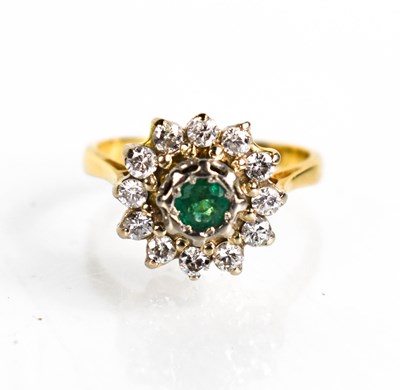 Lot 54 - An 18ct gold, diamond and emerald flowerhead...