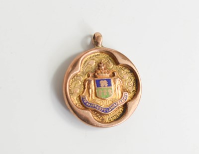 Lot 340 - A 9ct gold and enamel medallion, the crest...