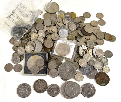 Lot 273 - A group of coins to include a silver dollar,...