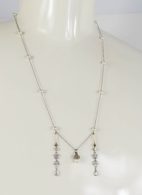 Lot 266 - A white gold and pearl necklace with acorn...