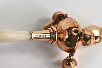 Lot 270 - A 9ct gold baby's rattle with whistle, mother...