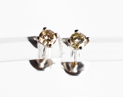Lot 69 - A pair of 9ct white gold and diamond earrings,...